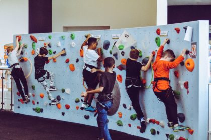 kids on test climb rock