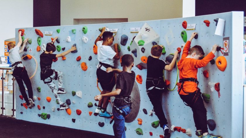 kids on test climb rock