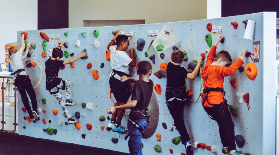 kids on test climb rock