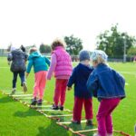 Children's Team Building on Green Grassland