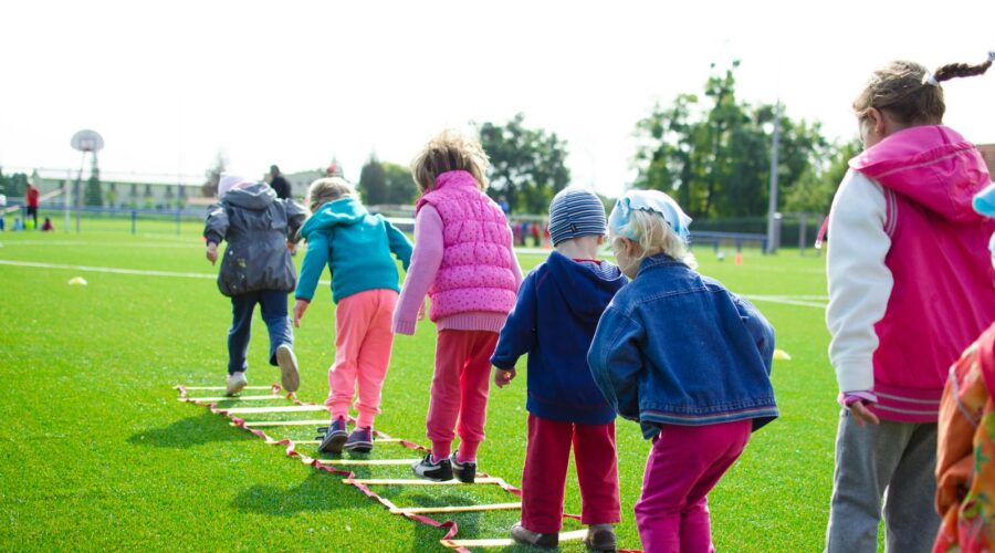 Children's Team Building on Green Grassland