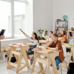 Students Raising their Hands in the Classroom