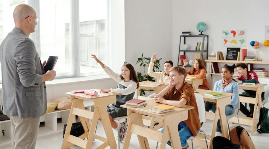 Students Raising their Hands in the Classroom