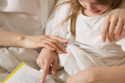 Mother and Daughter Reading a Book Together