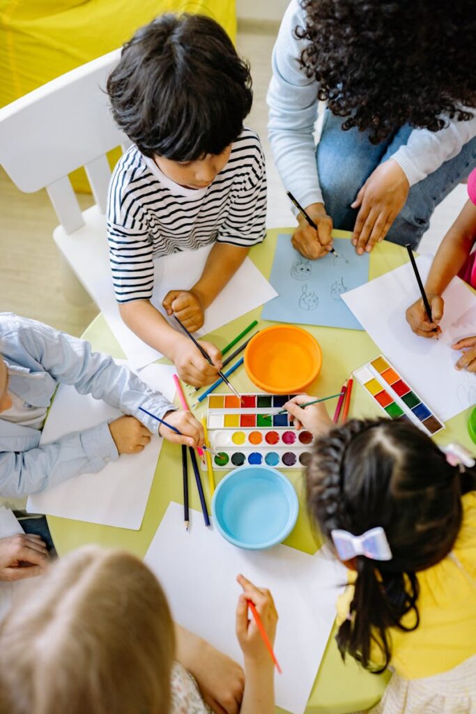 Children Painting With Water Colors