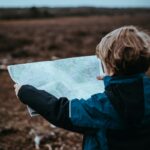 child looking at map