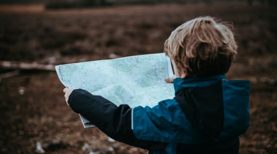 child looking at map